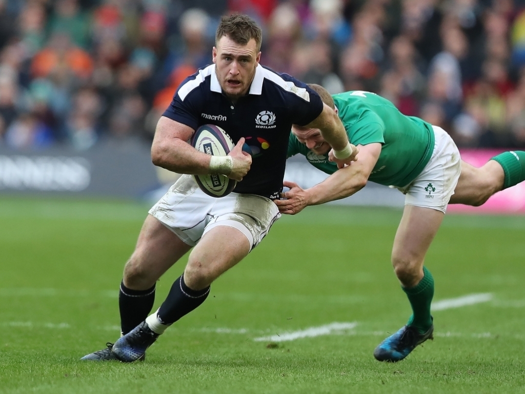 Stuart Hogg who resists the tackling of Keith Earls